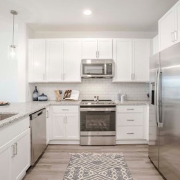 Spacious kitchens with thoughtful details Model kitchen at Rosalia Winter Park apartments in Winter Park, FL, featuring stainless steel appliances.