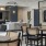 tv in front of couch and chairs in clubroom