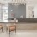 Lobby at Rosalia Winter Park apartments in Winter Park, FL, featuring a front desk with chairs, and modern decor.