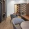 study cubicles and long bench seating with tables in co-working space
