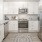 Model kitchen at Rosalia Winter Park apartments in Winter Park, FL, featuring stainless steel appliances.