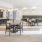 spacious clubhouse with kitchen, tables and chairs