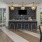 a kitchen with a bar and chairs