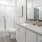 walk-in shower in bright bathroom